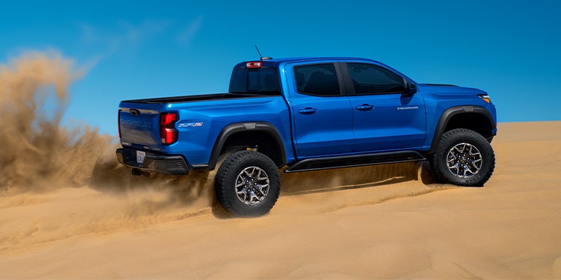 The Chevy Colorado Driving Over Steep Sand Dunes