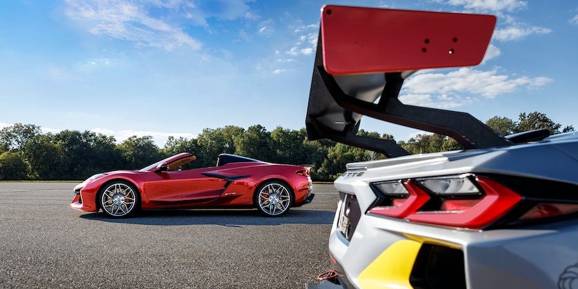 The 2022 C8R IMSA Corvette Championship Race Car Parked Alongside the Corvette Z06 on an Open Road
