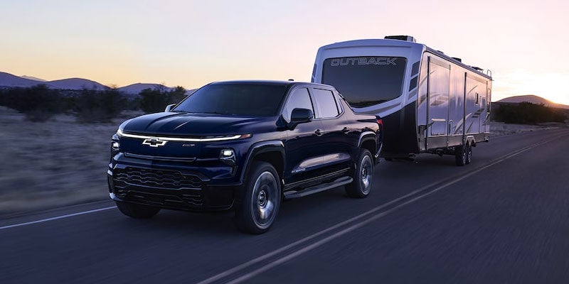 The 2024 Silverado EV Towing A Large RV Camper