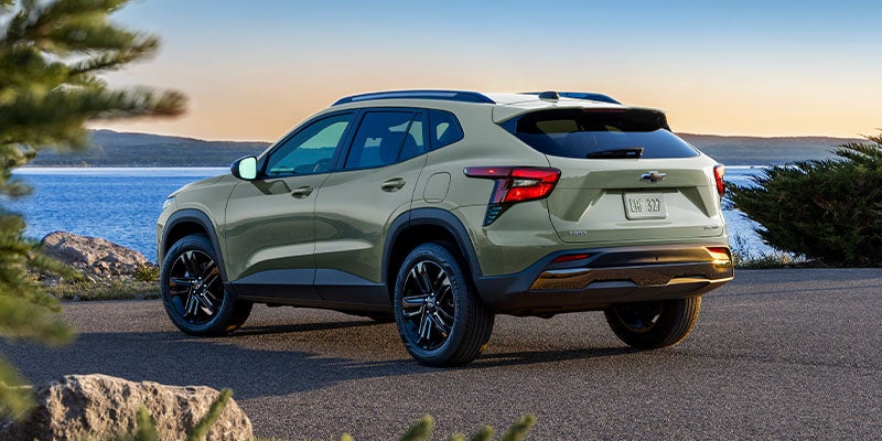 Chevy Trax Parked Facing a Lake at Sunset
