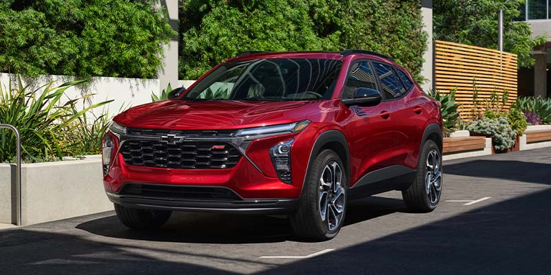 Women Crossing Street and 2025 Chevy Trax in the Background