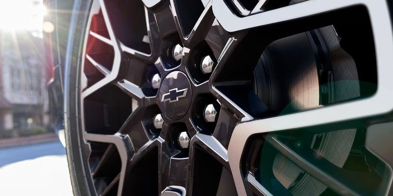Close-up of a 2025 Red Chevy Blazer Wheel Rims