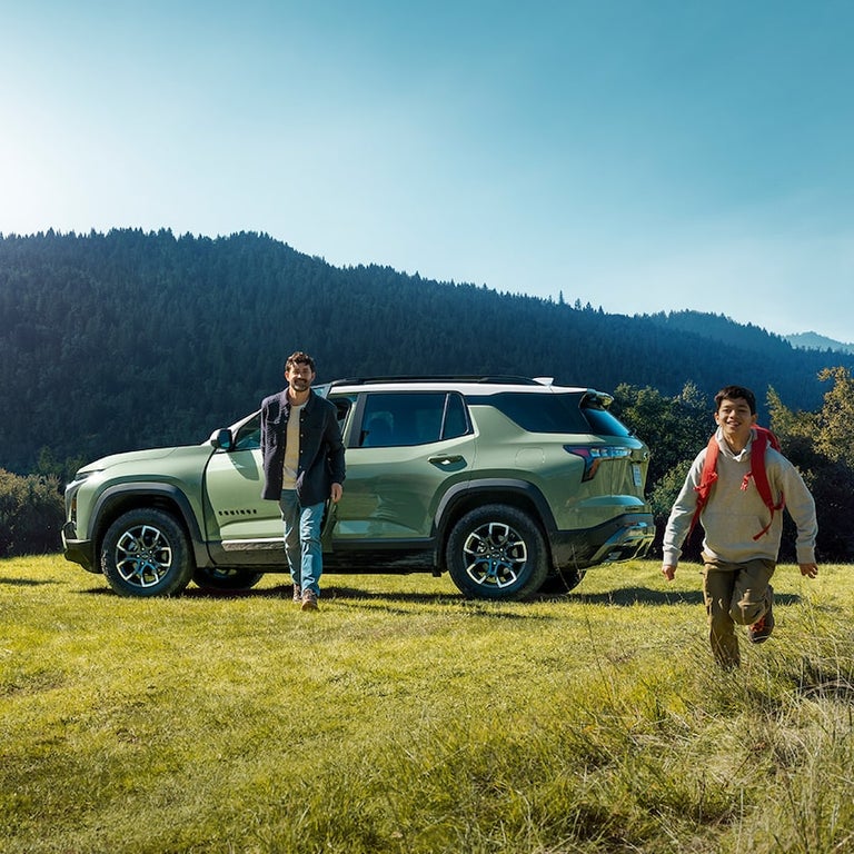Family in Front of their 2025 Chevy Equinox, Starting Adventure