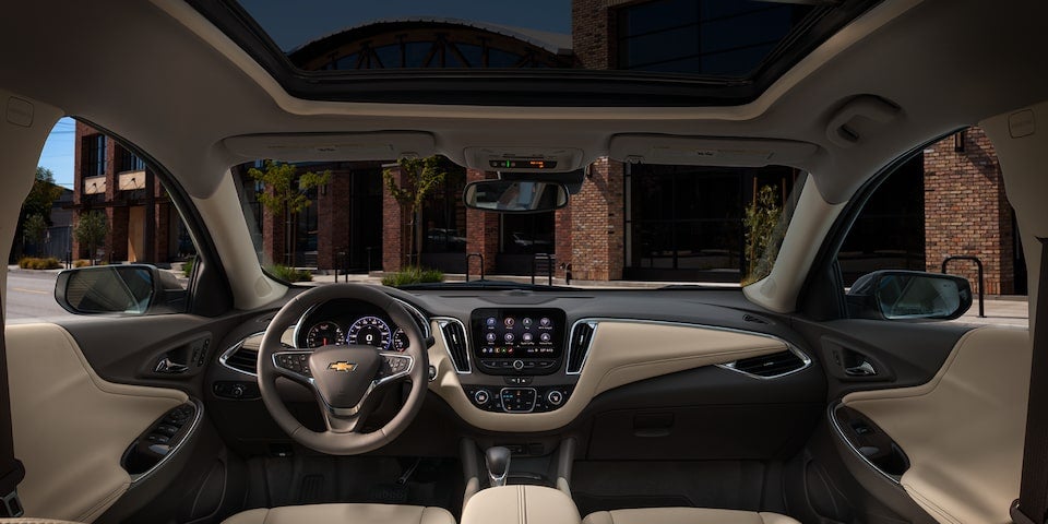 Inside Front and Center View of a 2025 Chevy Malibu Showing the Display Panel and Steering Wheel